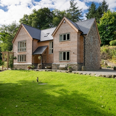 Weatherboard and stone house